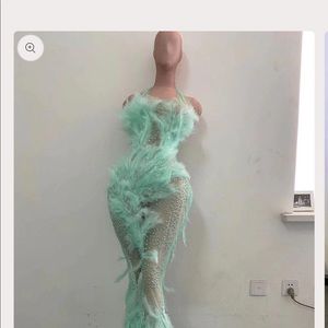 Custom made turquoise mess with feathers and crystals.